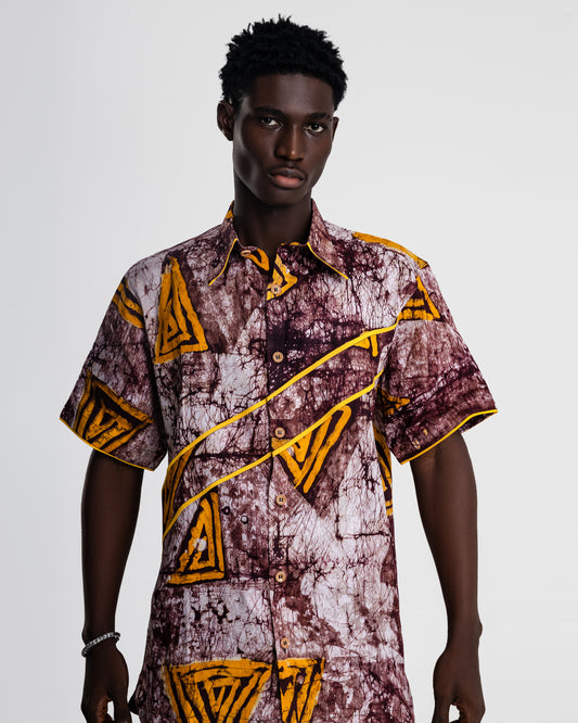 Model wearing Austine Mali The Chiji Shirt in abstract earthy print – front view